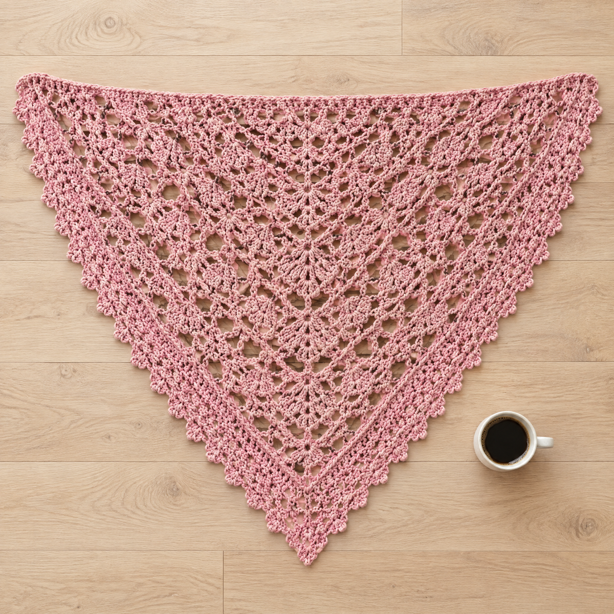 Willow Shawl crochet design shown next to everyday objects for scale