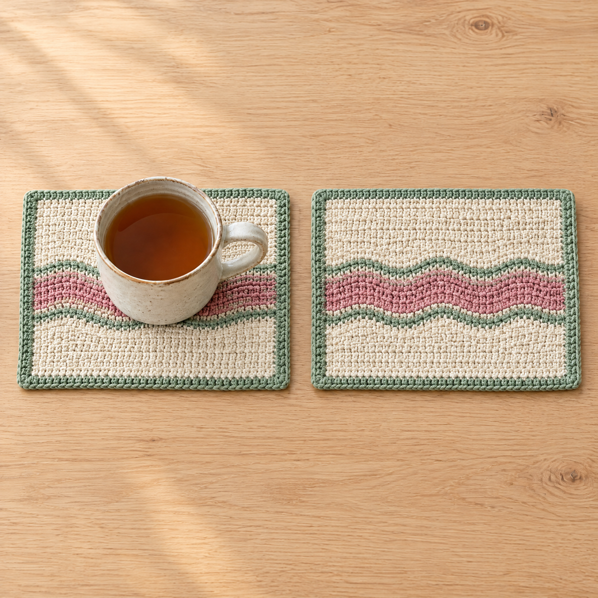 Cloudline Mug Rug Set crochet design shown next to everyday objects for scale